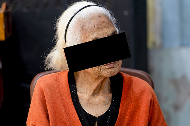 Khoi, sitting in a chair