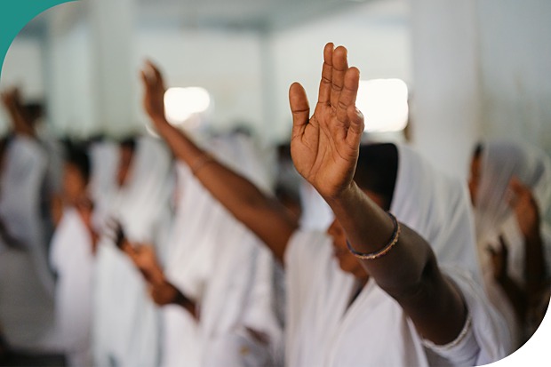 Women praying with their arms raised